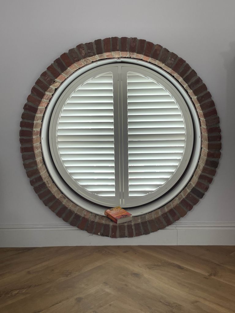 Shutter blinds for circle windows Shutters for shaped circular windows, supplied and fitted by The Valley Shutter Co West Yorkshire and North West England.