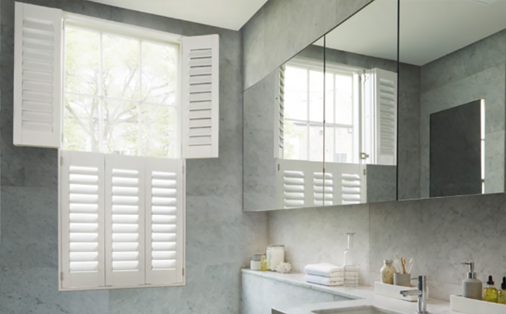 tier on tier shutters for bathroom windows Made to measure Plantation shutters supplied and fitted by The Valley Shutter Co West Yorkshire and North West England.